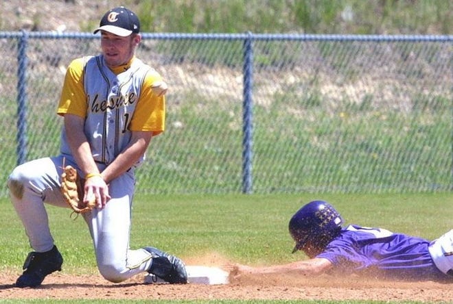 Chesnee's Trevin Taber, left, makes a play at third base during Monday's playoff game against Emerald.