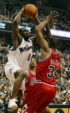 Washington's Gilbert Arenas goes to the basket against Chicago's Antonio Davis during the second quarter of Game 6 of the first-round playoff series, Friday in Washington.