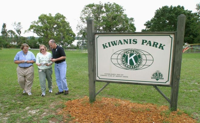 From left, Winter Haven Heights Neighborhood Association president Janet Golden looks over xeriscaping plans for Kiwanis Park with recreation supervisor Rachelle Selser and neighborhood coordinator Rick Bishop on Friday in Winter Haven.