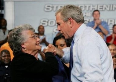 President Bush helps DeLois Killen rise to her feet after his speech last week at the Nissan North America Plant Warehouse in Canton, Miss. As Bush promotes changes in Social Security to affect younger workers, Killen, 71, represents a growing trend: Americans who work past retirement age.