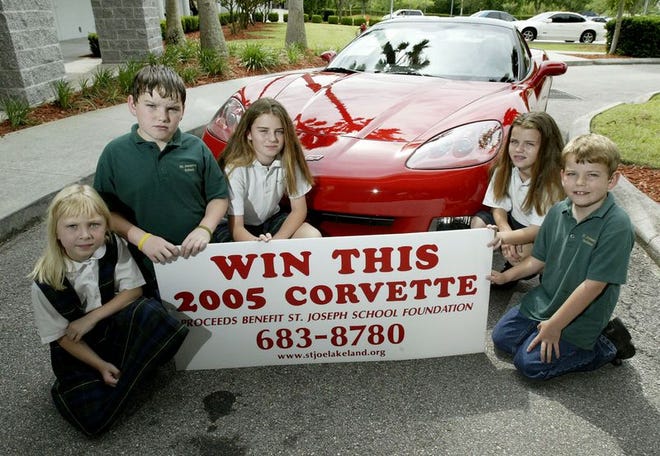 Alaina Olson, from left, Seamus McHugh, Katie McHugh, Grace McHugh and Jack McHugh show off the new Corvette to be raffled.