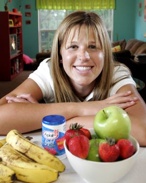 University of Florida sophomore Heather Hiznay, 20, is trying to keep to her New Year's resolution of eating better by including more fruit in her diet.