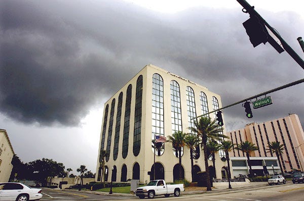 Storm clouds roll in Thursday over the CenterState Bank building on South Florida Avenue in Lakeland. Recent heavy rains likely were caused by Tropical Storm Arlene, the first named storm of the Atlantic hurricane season.