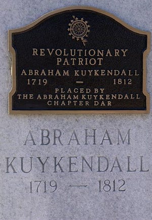This is the Daughters of the American Revolution plaque placed at Abraham Kuykendall's marker located at the Mud Creek Baptist Cemetery.