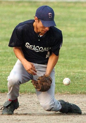Seacoast´s David Garneau stops a hard grounder during his team's 9-4 loss in the winner's bracket final of the New England Senior Babe Ruth Regional tournament on Monday. Seacoast resumed play in the loser's bracket final today at 3 p.m.