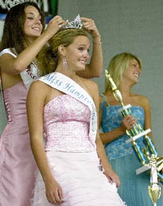 Melissa Theriault, Miss Hampton Beach 2004, crowns Alexandra Harrington the new Miss Hampton Beach as runner-up Caitlin Sanders holds the second-place trophy.