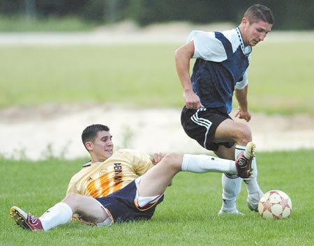 Kingston Braves midfielder Brendon MacMahon (left), seen here against Hamilton-Wenham, scored the game-winning goal as the Braves won their second straight New Hampshire Summer Soccer League Division II championship.