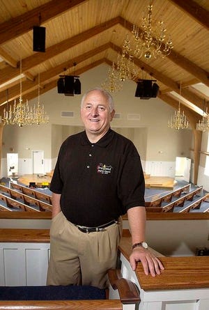 The Rev. Mike Smith, pastor at Fruitland Baptist Church, stands in the balcony of the newly constructed sanctuary. The church will celebrate its 130th anniverary Sunday, Sept. 11.