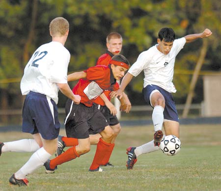 York High School?s Matt Carey (right) takes control of the ball during Tuesday?s Class B boys soccer game against Wells. York won, 8-2.