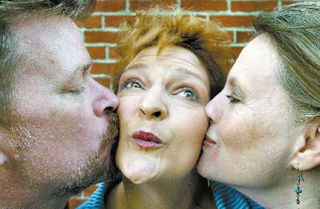 Marian Marangelli, the star of the new play, ?M is for Marian,? gets a kiss from the creators of the show, George Hosker Jr. and Laura Pope.