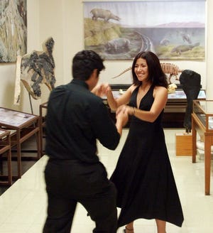 Kelvin Urday and Christie Guerrero De Luna enjoy a salsa during a gala dance at Smith Hall.