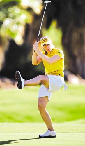 Annika Sorenstam does a high kick as she celebrates a birdie putt on the second hole during the third round Saturday.