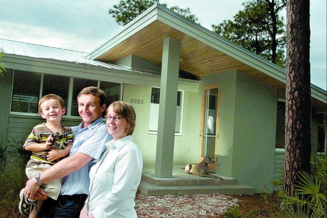 Adam and Holly Antoszewski, with their son, Liam, and dog, Casper, at home in Bradenton's River Forest. The couple invested considerable "sweat equity" in the house's construction.