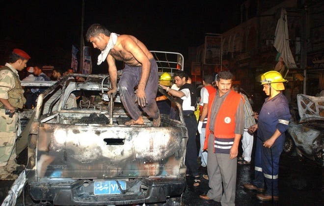 A burned-out truck remains after a bombing about 8:30 p.m. Monday in Basra, Iraq, that killed at least 20 people and injured 40.