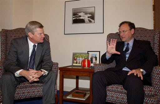 Judge Samuel Alito, right, meets with Sen. Tim Johnson, D-S.D., on Capitol Hill on Tuesday to discuss his nomination to the Supreme Court.