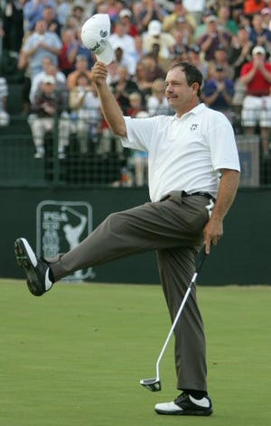 Bart Bryant celebrates after sinking his final putt on the 18th hole to win the Tour Championship at East Lake Golf Club in Atlanta, Sunday. Bryant finished 17-under par and six shots ahead of second-place finisher Tiger Woods.