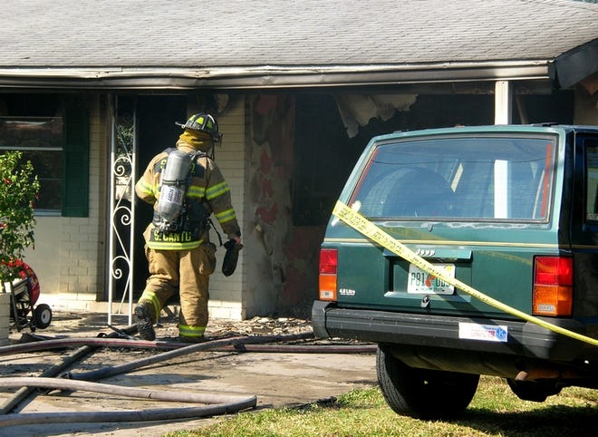 Sarasota County firefighters respond to a house fire on Larkin Street on Friday afternoon. The family was renting the house and didn't have insurance.