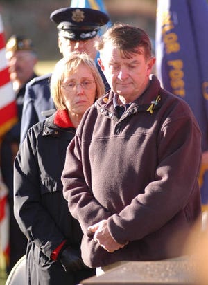 Dorothy and James Sullivan watch the unveiling of a memorial dedicated to their son, Capt. Christopher J. Sullivan, yesterday in Princeton.