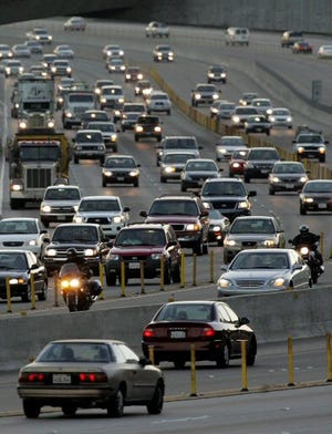 Early morning commuters stack up along the 91 freeway headed in to Orange County in Anaheim, Calif.