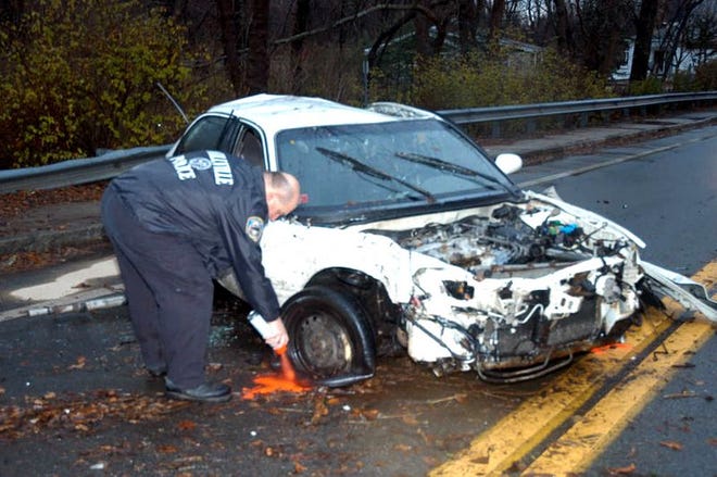 Millville Police Officer Michael Merolli, the department’s accident reconstructionist, at the scene of the fatal crash.