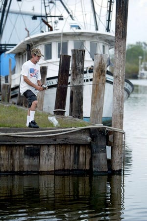 Roland Boudreaux of Chauvin fishes from Bayou Little Caillou in Chauvin.