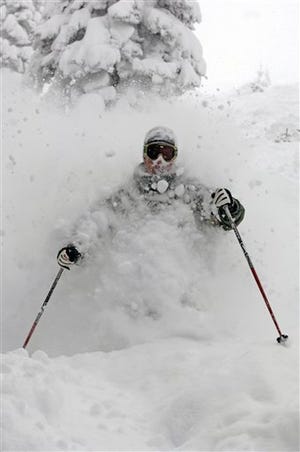 Joe Kelly samples the chest-deep snow Monday after more than 47 inches fell in 48 hours in Steamboat Springs, Colo.