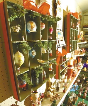 Collectable tree ornaments, left, overlook the entire display at the "Collecting Christmas" exhibit at the Monroe County Historical Association in Stroudsburg.