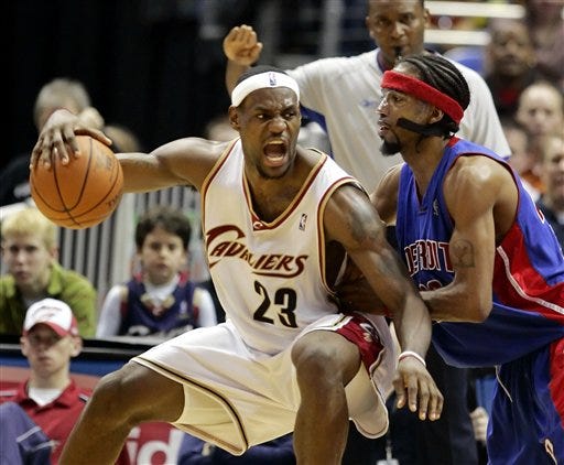 Cleveland Cavaliers' LeBron James (23) works against Detroit Pistons' Richard Hamilton during fourth quarter NBA action Saturday, Dec. 31, 2005, in Cleveland. James scored 30 points in leading Cleveland over Detroit 97-84.
