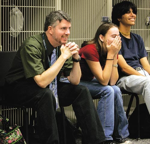 P.K Yonge performing arts instructor T.O. Sterrett, left, watches a group improvisation exercise with students Kay Williams, 16,
 and Narayan Hearn, 17.