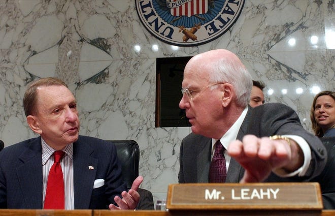 Senate Judiciary Committee Chairman Sen. Arlen Specter, R-Pa., left, talks with Sen. Patrick Leahy, D-Vt., ranking Democrat of the committee, on Capitol Hill on Friday.