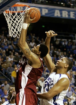 Alabama's Jermareo Davidson goes inside Kentucky's Randolph Morris, right, for two of his game-high 28 points.