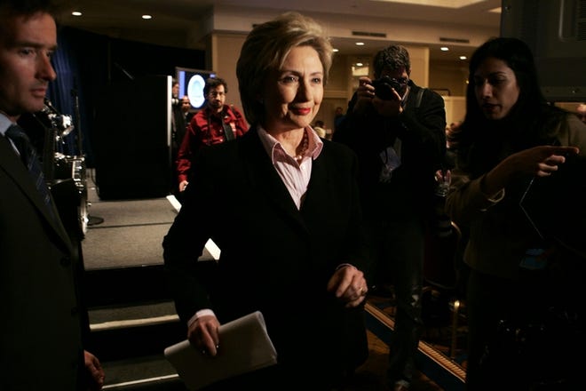 United States Sen. Hillary Clinton, D-N.Y., leaves the stage after addressing mayors attending the 74th winter meeting of the The United States Conference of Mayors on Wednesday in Washington.