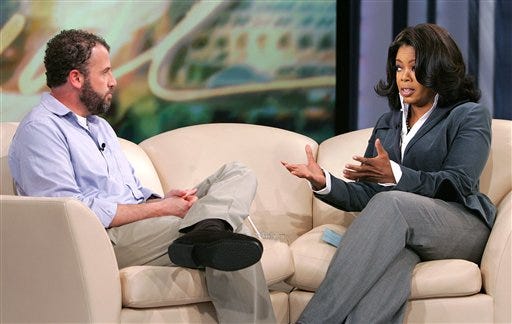 Oprah Winfrey, right, talks to James Frey, author of "A Million Little Pieces," in Chicago, challenging him over his disputed memoir.