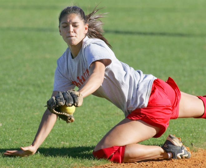 Karla Pladna makes a diving stop during a CFCC softball practice. The Lady Patriots open the season on Saturday.