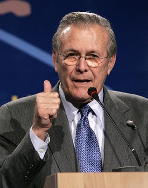 Defense Secretary Donald Rumsfeld gestures while speaking Friday during a media conference after a meeting of NATO defense ministers in Taormina, Sicily. Photo Credit here