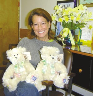 Susan Rubin, chairwoman of the Daffodil Days campaign for Monroe County's American Cancer Society, and her two furry Boyds Bear friends hope that residents will order flowers by Friday.