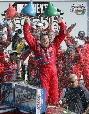 Tony Stewart celebrates Saturday's Busch Series victory in Daytona's Victory Lane.