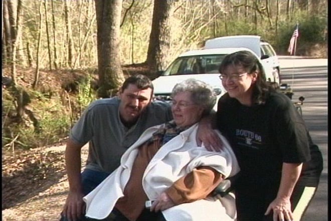 Anthony Tillotson (left) and his mother Margie Tillotson (center), reunited after 41 years.