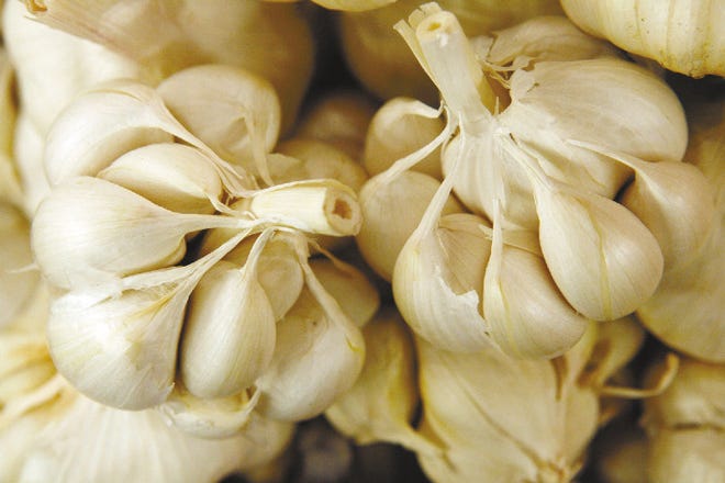 Garlic bulbs, separated into cloves, are offered for sale in a Whole Foods market in New York City.