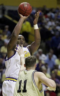 Louisiana State's Glen Davis shoots over Vanderbilt's Alan Metcalfe during the first half at the 2006 Southeastern Conference basketball tournament, Friday, March 10, 2006, at the Gaylord Entertainment Center in Nashville, Tenn.