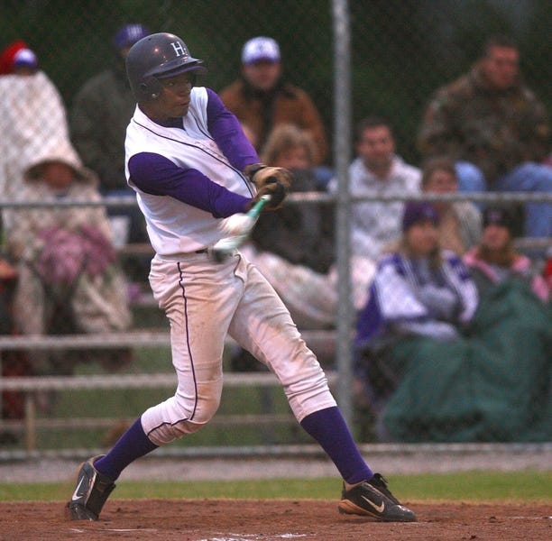 Holt’s Allen Watson connects for a two-run single in the second inning against LAMP on Thursday. Watson was also the winning pitcher in the Ironmen’s 7-5 victory.