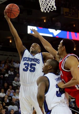Memphis' Darius Washington (35) shoots over Bradley's Patrick O'Bryant, right, during the first half of their NCAA Tournament regional semifinal college basketball game, Thursday, March 23, 2006, in Oakland, Calif. Memphis' Joey Dorsey, center, watches.