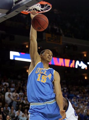 UCLA's Ryan Hollins (15) dunks against Memphis during the second half of their NCAA Tournament regional final college basketball game, Saturday, March 25, 2006, in Oakland, Calif.