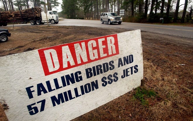 Signs like this one near Plymouth, N.C., have been posted along roads by local landowners and environmentalists who oppose plans by the U.S. Navy to build an outlying landing field in east North Carolina.