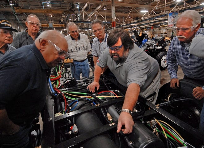 Freightliner Custom Chassis Senior Service Trainer Mike Cody, center, instructs a class at a two-day camp held at the

company in Gaffney where RV owners can learn more about their vehicles.