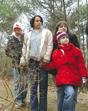 Taking part in a nature walk at the Monroe County Environmental Education Center are, from left, Emily Prendergrast, 12, Lea Prendergrast, Susan Prendergrast, back, and Sandra Prendergrast, 5, Susan lives in Pocono Summit and her family was visiting from Staten Island.
