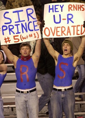 The Nixon Nutts, a group of enthusiastic students, have become a mainstay at games. Signs are also a part of the group's fun,

as one Nutt shows his

support for Prince Miller, a Georgia-bound

defensive back.