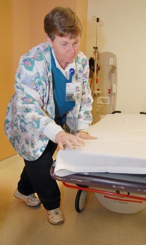 Vicki Crowe, who works with housekeeping at the Spartanburg Regional Health System, fixes up a room for the next patient. The South Carolina Governor's Committee on Employment of People with Disabilities has named the hospital its Large Employer of the Year.