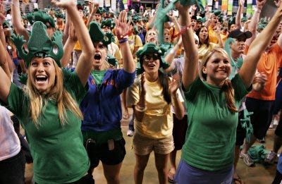 Lindsay McDaniel, 21, Katie Darst, 19, Julie Ramos, 19, and Brie Jones, 21, all members of Delta Gamma sorority, cheer after the Gators scored in the first half of the Final Four NCAA semi-final game, Saturday, April 1, 2006. The students were watching the game, which took place in Indianapolis, Ind., on a giant television screen during the University of Florida Dance Marathon at the Stephen C. O'Connell Center.