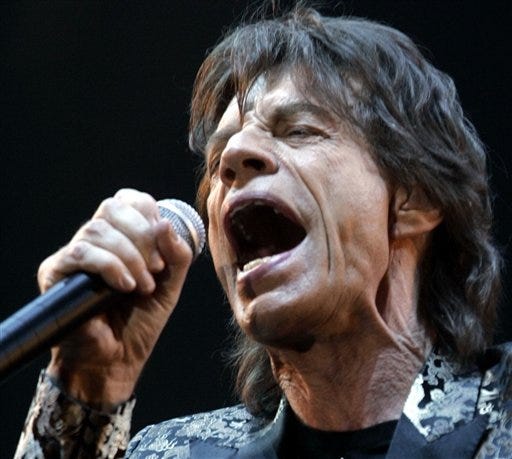 Mick Jagger, lead singer of the Rolling Stones, performs in the 8,000-seat Shanghai Grand Stage in Shanghai, China, Saturday April 8, 2006. The Rolling Stones opened their first-ever concert in mainland China on Saturday with "Start Me Up," a song with suggestive lyrics that apparently made it past the censors who banned five other songs.